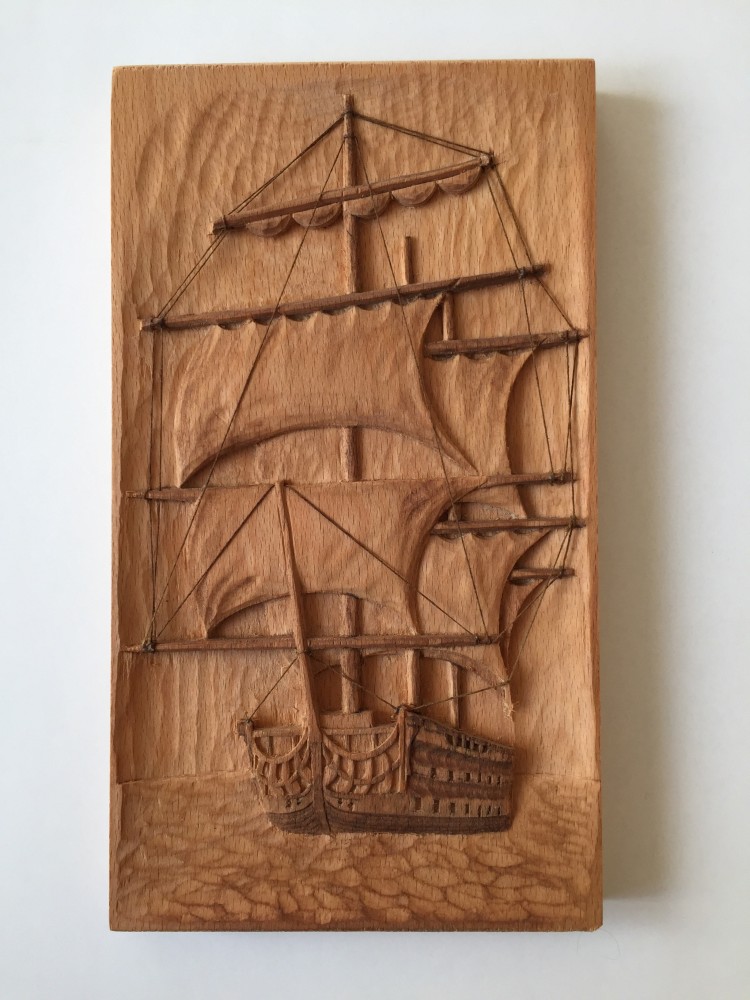 hand carved wooden plaque of an ancient ship 
beech wood